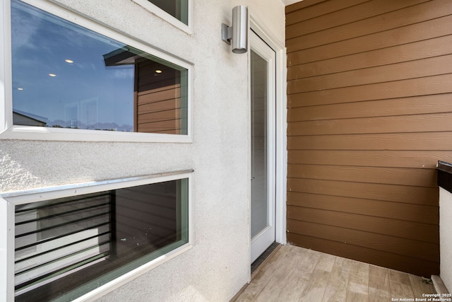 doorway to property with stucco siding