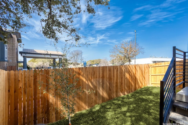 view of yard featuring a fenced backyard