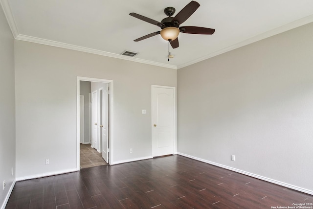 unfurnished room with visible vents, ornamental molding, wood finished floors, baseboards, and ceiling fan