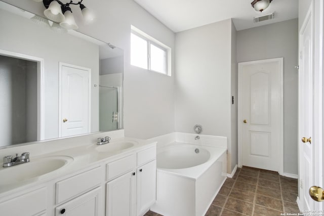 full bathroom with a sink, a shower stall, a bath, and visible vents