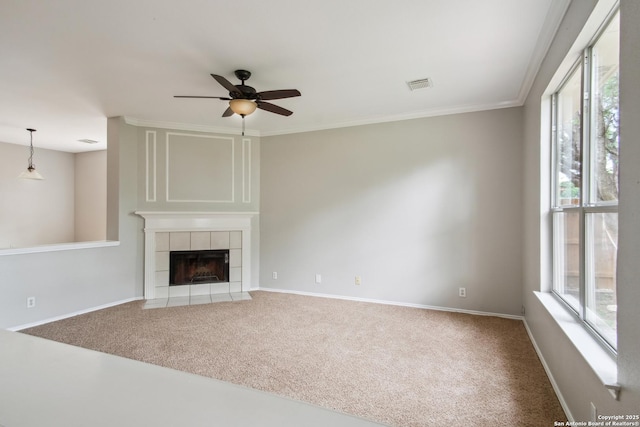 unfurnished living room featuring visible vents, ceiling fan, a wealth of natural light, and carpet floors