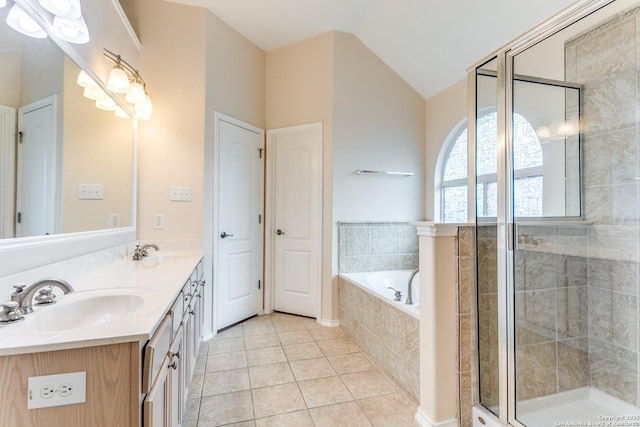 bathroom featuring a sink, a bath, tile patterned floors, and a stall shower