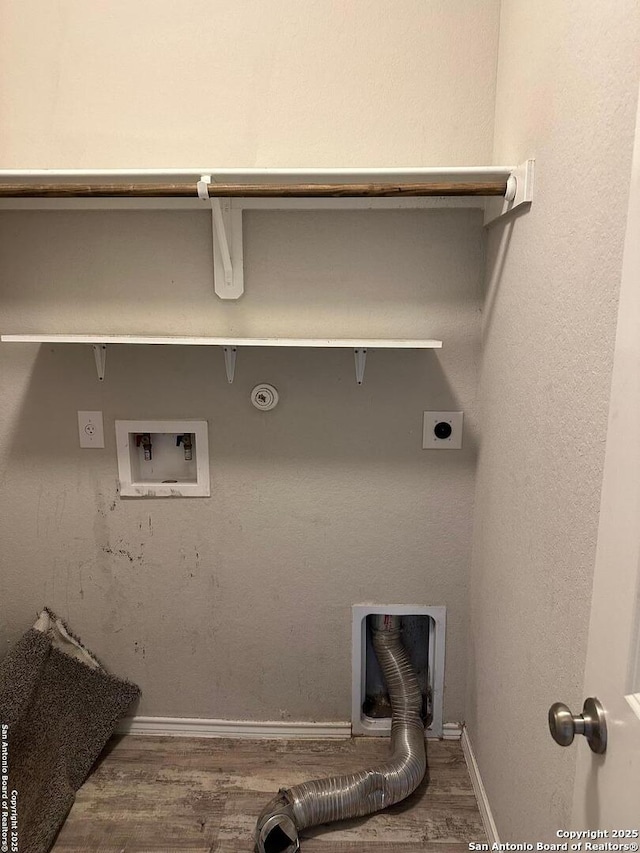 washroom featuring gas dryer hookup, hookup for an electric dryer, washer hookup, wood finished floors, and baseboards