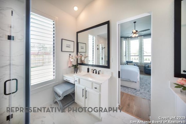 bathroom featuring ceiling fan, vanity, ensuite bath, a marble finish shower, and wood finished floors