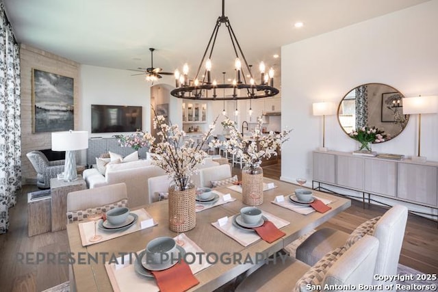 dining room featuring a baseboard radiator, ceiling fan with notable chandelier, recessed lighting, and wood finished floors