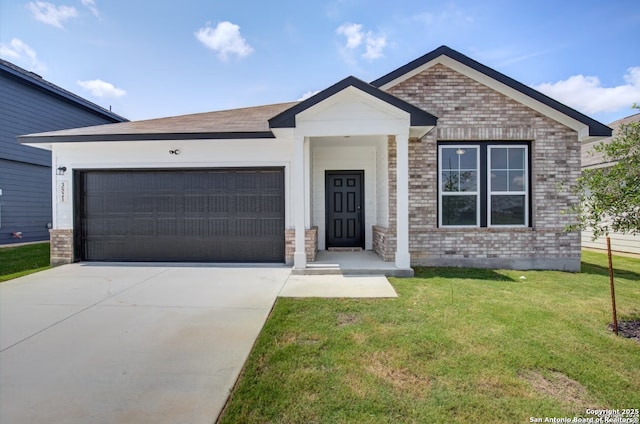 ranch-style house featuring a garage, driveway, a front lawn, and brick siding