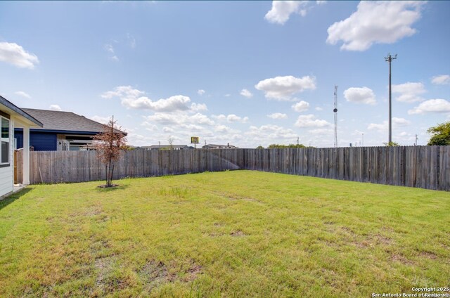 view of yard featuring a fenced backyard