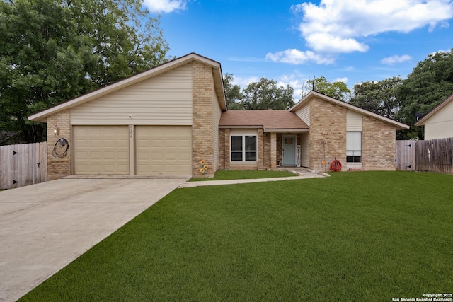 mid-century modern home with fence, a front yard, brick siding, an attached garage, and driveway