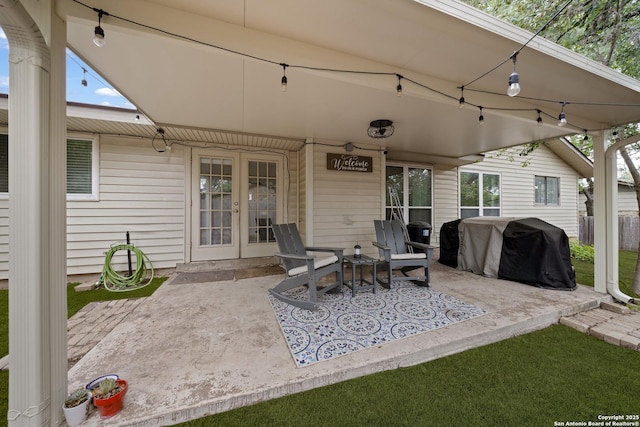 view of patio with french doors and a grill