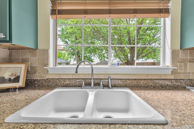details with a sink and backsplash
