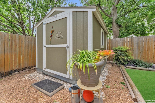 view of shed featuring a fenced backyard