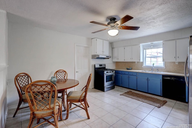 kitchen featuring blue cabinets, stainless steel gas range oven, dishwasher, light countertops, and under cabinet range hood