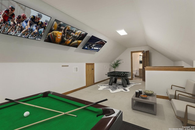 recreation room with carpet flooring, baseboards, vaulted ceiling, and visible vents