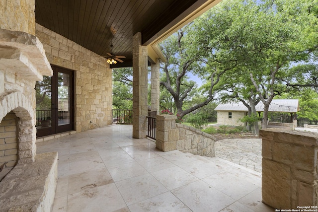 view of patio featuring french doors and a ceiling fan