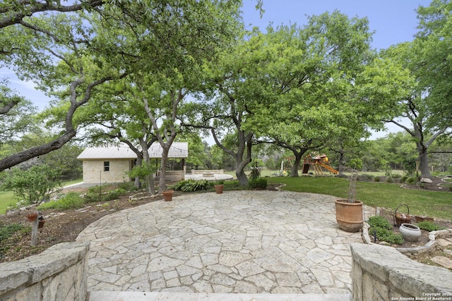 view of patio with a playground
