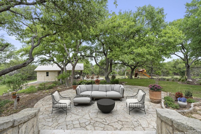 view of patio with an outdoor hangout area and a playground