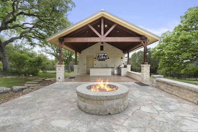 view of patio / terrace featuring area for grilling, a gazebo, and a fire pit