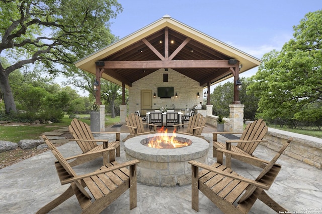 view of patio with a gazebo and an outdoor fire pit
