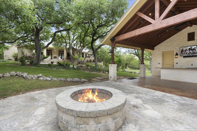 view of patio with an outdoor fire pit