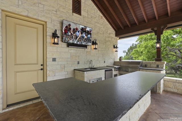 view of patio with a sink and area for grilling