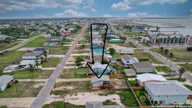 birds eye view of property with a residential view