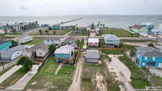 drone / aerial view featuring a water view and a residential view