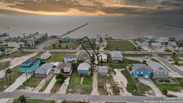 drone / aerial view featuring a water view and a residential view