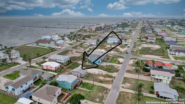 bird's eye view with a water view and a residential view