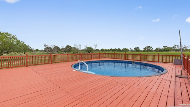 view of pool featuring a fenced in pool and a wooden deck