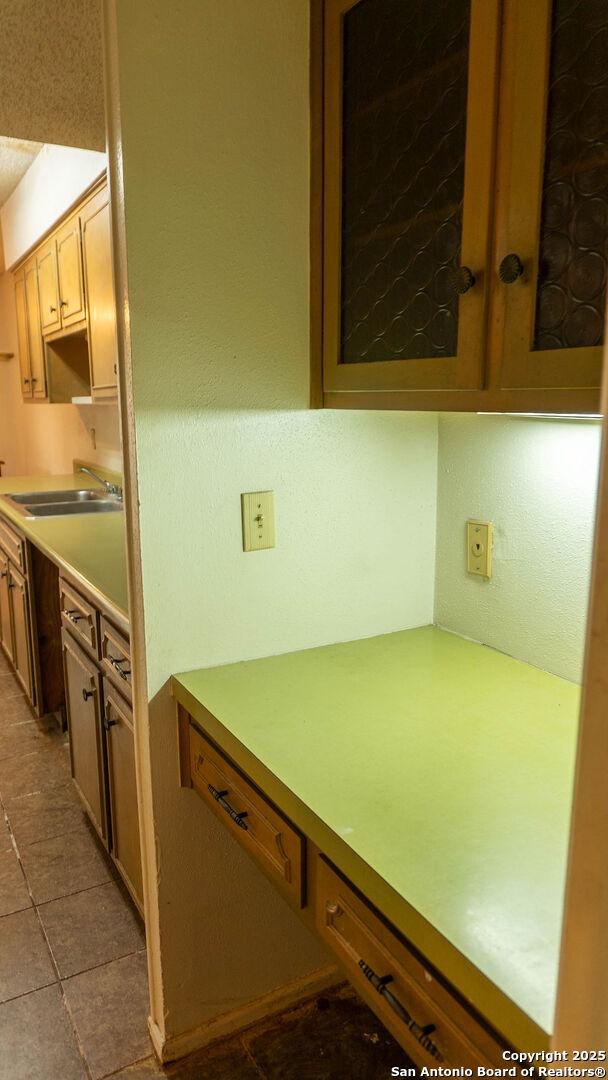 kitchen with light countertops and a sink