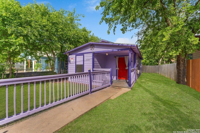 exterior space featuring a yard and a fenced backyard