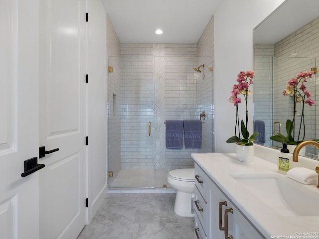 bathroom with toilet, a stall shower, tile patterned floors, and vanity
