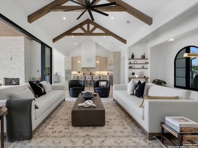 living room featuring high vaulted ceiling, beamed ceiling, a ceiling fan, and visible vents