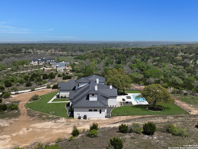 aerial view featuring a view of trees
