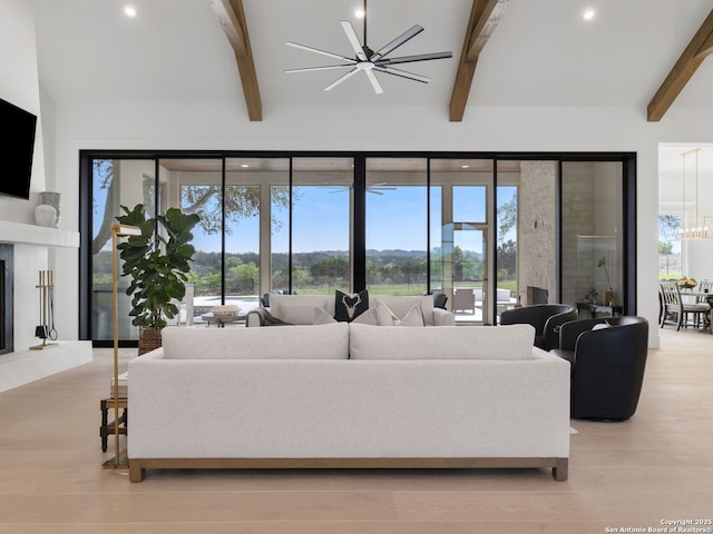 living room with a fireplace, a chandelier, recessed lighting, wood finished floors, and beamed ceiling
