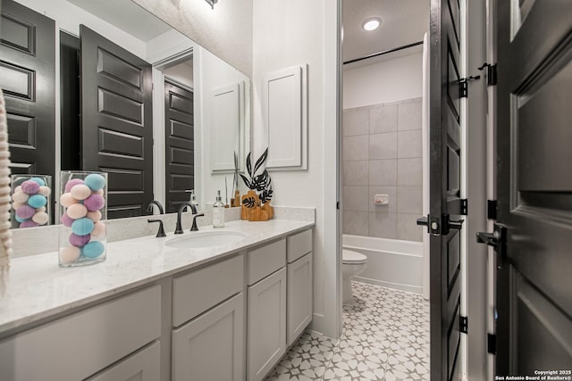 full bathroom with toilet, tile patterned floors, bathtub / shower combination, and vanity
