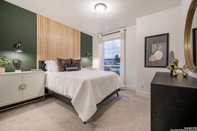 carpeted bedroom with baseboards