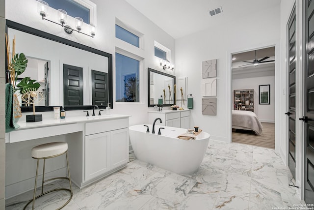full bathroom featuring vanity, visible vents, marble finish floor, connected bathroom, and a freestanding bath