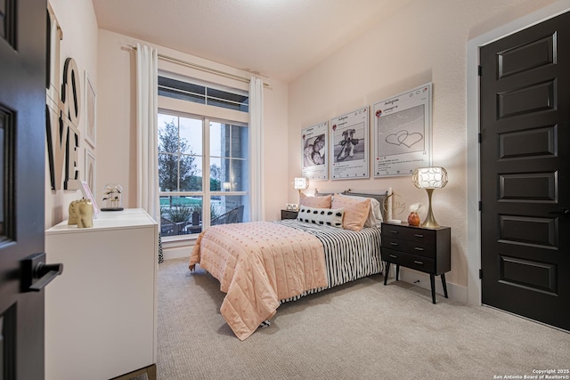 bedroom with baseboards and carpet flooring