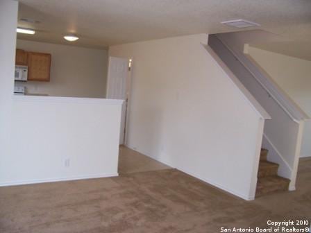 San Antonio, TX 78244 - interior space featuring stairway and carpet flooring