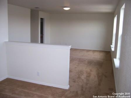 San Antonio, TX 78244 - carpeted spare room featuring baseboards
