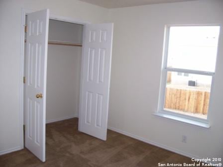 San Antonio, TX 78244 - unfurnished bedroom with a closet and baseboards