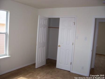 San Antonio, TX 78244 - unfurnished bedroom with a closet and baseboards