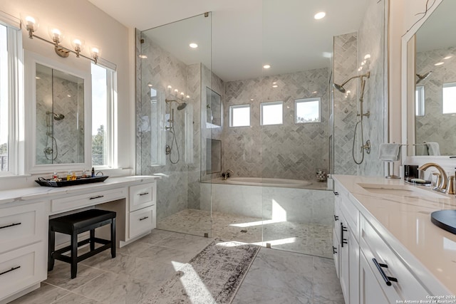 full bathroom with marble finish floor, a tile shower, a bath, and vanity