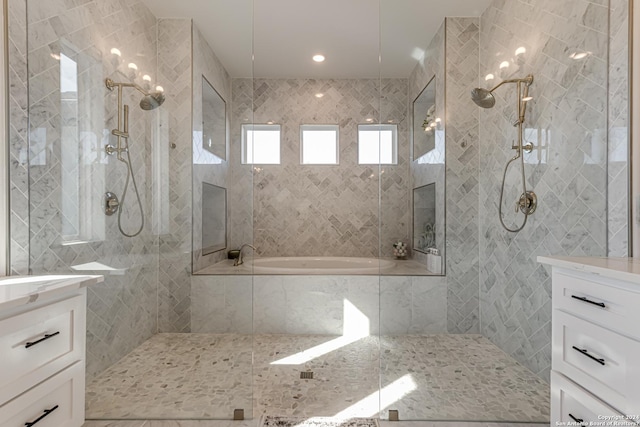 full bathroom with walk in shower, tile walls, a garden tub, and vanity