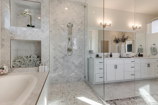 full bathroom with double vanity, a tile shower, a garden tub, and marble finish floor