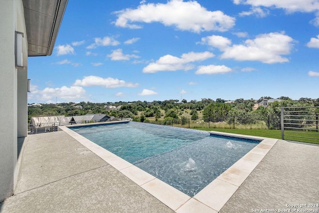 view of pool featuring a patio, fence, and a fenced in pool