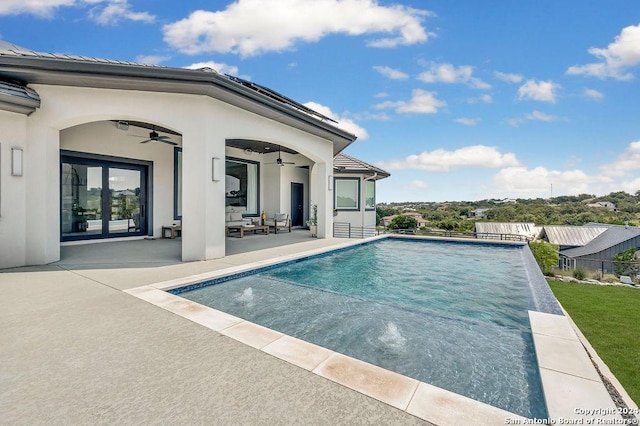 view of swimming pool with fence, a fenced in pool, an outdoor living space, a ceiling fan, and a patio