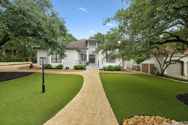 view of front of property with cooling unit and stucco siding