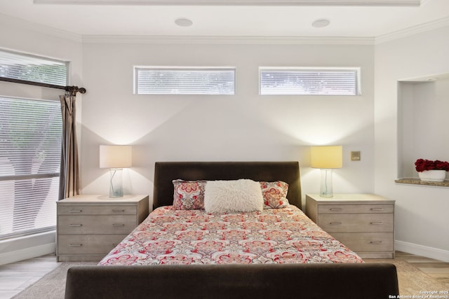 bedroom with baseboards, multiple windows, and crown molding
